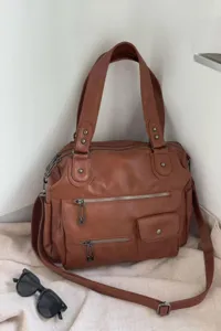 Brown vintage motorcycle travel tote bag, large capacity multi-pocket design detail view.