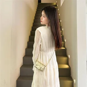 Women quilted chain mini crossbody bag, elegant shoulder bag for stylish daily outfit.