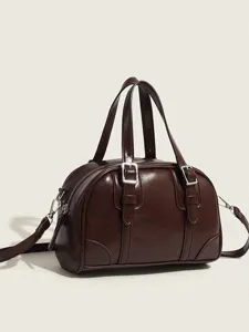 Retro brown leather pillow bag for women, chic top handle shoulder crossbody handbag.