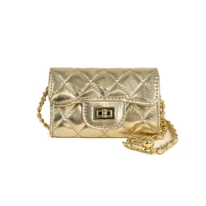 Gold quilted mini crossbody bag featuring a chic chain strap and secure turn lock closure.