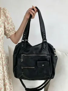 Black PU leather large capacity tote bag with multi-pockets and shoulder straps for women.
