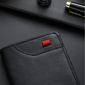 Men's minimalist black bifold short wallet with card slots and stylish red tab detail.