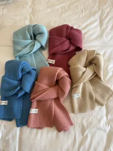 Solid color knit winter scarf variant detail, soft warm wool neck warmer for women and men.