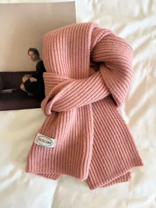 Cozy pink ribbed knit scarf detail, soft winter warm neckerchief for stylish daily wear.