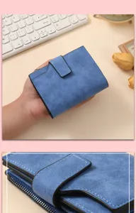 Detailed view of women's short frosted blue wallet with zipper coin pocket and snap buckle card slots.