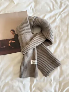 Korean minimalist solid color knitted scarf for women, cozy winter warm neckwear, chic design.