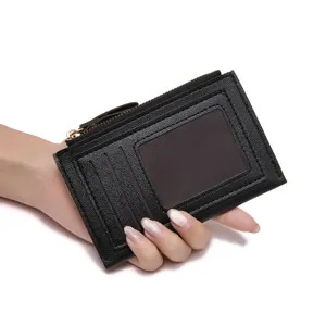 Black PU leather mini card holder wallet with zipper pocket and ID window for women daily use.
