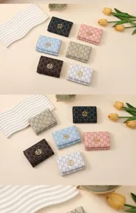 Fashion letter print trifold women wallet with multiple card slots and elegant design.