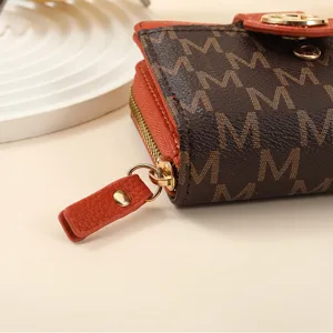 Stylish short brown monogram wallet with orange leather trim, compact card holder and zipper.