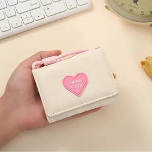 Cute minimalist trifold women wallet with lanyard and pink heart design for daily use.