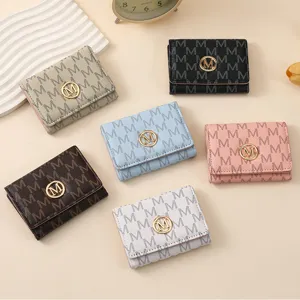 Fashion women trifold wallet with M monogram and metal buckle, multi-card slot design.