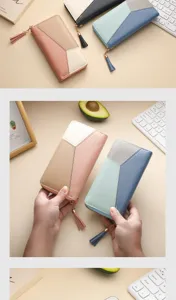 Women's color block long wallet large capacity zipper clutch purse with stylish tassel pendant.