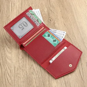 Red women's short tri-fold wallet with multiple card slots, ID window and snap coin pocket.
