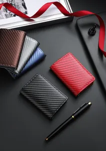 Detail view of men RFID blocking slim carbon fiber automatic pop up card holder wallet.