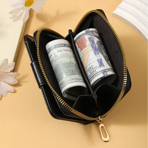Black leather zip-around women wallet with multiple card slots and cash compartments top view