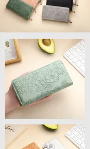 Detailed view of women embossed PU leather long wallet with multiple card slots and floral pattern.
