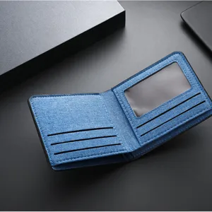 Men's short canvas wallet with multiple card slots and clear ID window, blue denim design.