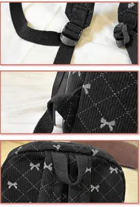 Detailed view of black corduroy backpack straps, bow pattern texture and top handle loop.