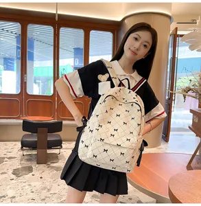 Detailed view of the cute women's backpack with black bows, perfect for daily casual use.