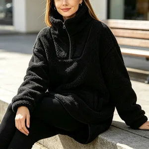 Detail view of women's black fleece half-zip high collar pullover sweatshirt for cozy daily wear.