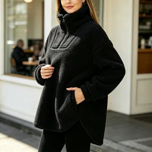 Women fleece half-zipper high collar pullover sweatshirt in black with cozy side pockets.