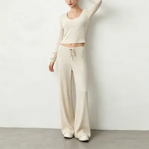 Ribbed knit long sleeve crop top and wide leg pants closeup view showing soft texture.