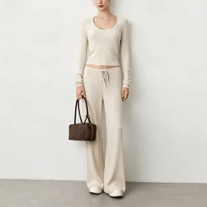 Ribbed knit yoga set featuring a scoop neck crop top and wide leg pants for women.