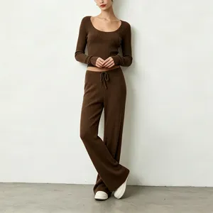 Ribbed knit yoga set featuring a scoop neck crop top and draped wide leg lounge pants for women.