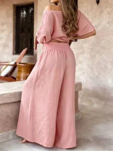 Back view detail of pink off-the-shoulder summer casual top and matching wide leg pants set.