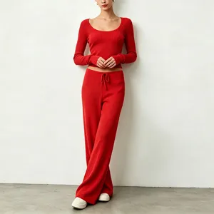 Red ribbed knit crop top and wide leg pants set, detailed view of soft textured outfit.
