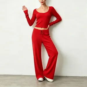 Red ribbed knit crop top and wide leg pants set, detail view of soft fabric and drawstring.