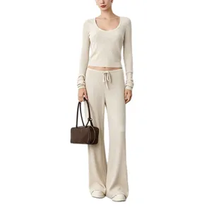 Beige ribbed knit long sleeve crop top and wide leg pants loungewear yoga set for women.