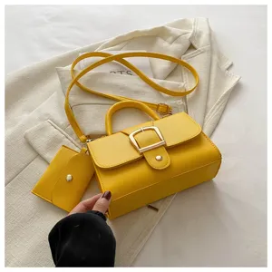Yellow retro crossbody small square bag detail view with shoulder strap and mini coin purse