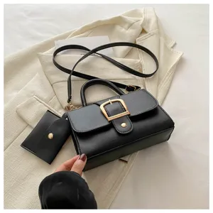 Minimalist retro black crossbody shoulder handbag with chic metal buckle and card pouch accessory.