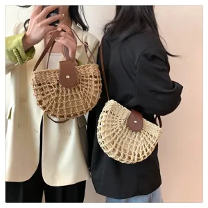 Woven straw saddle bag detail showing intricate mesh texture and brown leather flap closure.