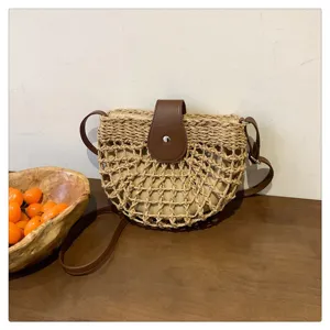 Woven straw crossbody bag for women, stylish summer saddle bag for beach vacation.