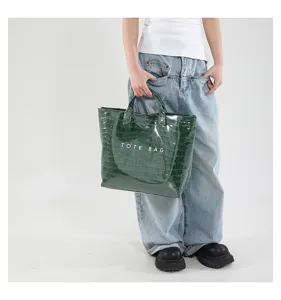Grüne Kroko-Textur Tote Bag Detailansicht, stilvolle und modische Alltagstasche für Damen.