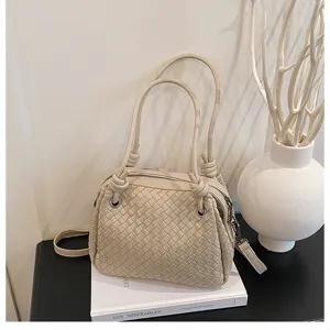 Woven leather shoulder tote bag beige handbag detailed view showing exquisite craftsmanship