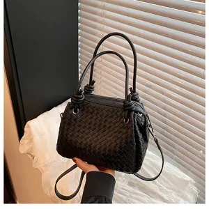 Black woven leather tote bag with metal knot handles, large capacity stylish shoulder handbag.