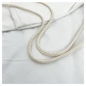 Close-up detail of a cream white braided drawstring, showing fine texture for women handbag.