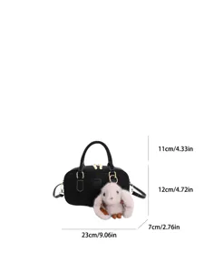 Black retro bowling shoulder handbag with cute plush rabbit charm and gold hardware.