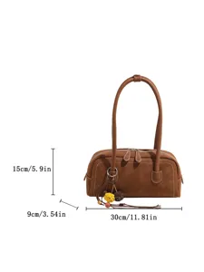 Classic retro brown leather baguette shoulder bag with stylish tassel charm and practical size.