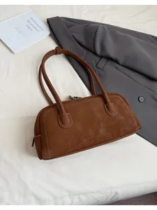 Retro brown leather baguette shoulder bag, stylish casual handbag for women daily wear.