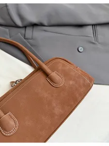 Retro brown baguette shoulder bag for women, stylish vintage PU leather handbag with stitching.