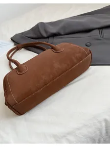 Brown leather baguette shoulder bag, retro chic handbag for women, elegant daily accessory.