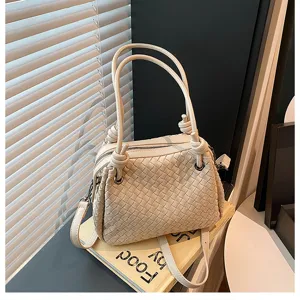 Elegant beige woven leather handbag with stylish knotted handles, perfect women shoulder bag.