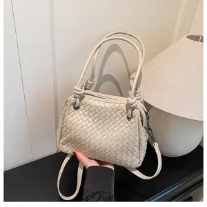 Woven leather shoulder bag with metal cord knots, elegant beige tote for women daily wear.