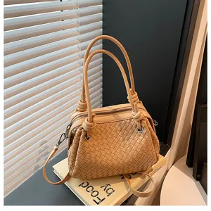 Light khaki woven leather shoulder bag for women, large capacity stylish tote with knot handle.