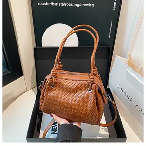 Woven leather handbag for women, chic brown shoulder tote bag with top handle and spacious design.