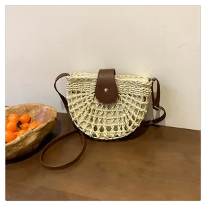 Woven straw crossbody saddle bag for women, featuring a chic PU leather flap and summer vibe.